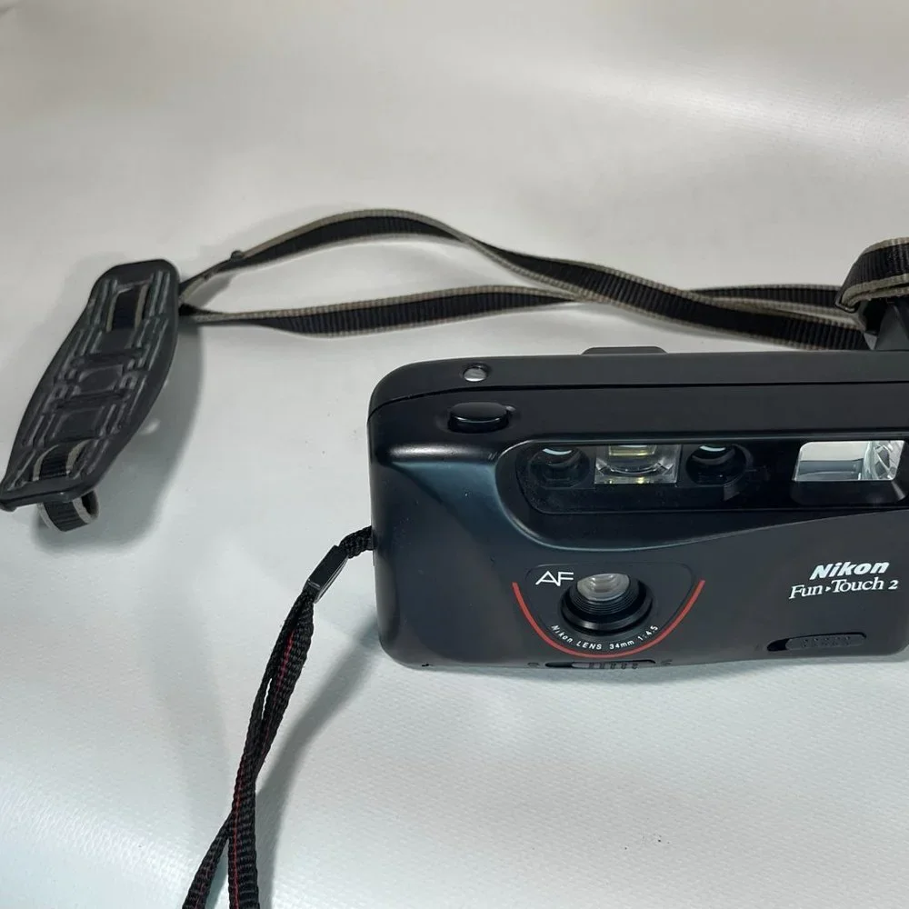 Canon E05 750 35mm camera and Nikon Fun touch 2 35mm camera